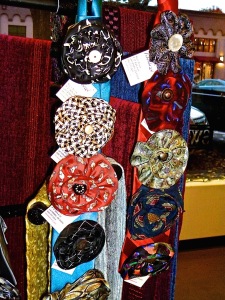 Upcycled Silk Flower Pins by Paula Dennis and backdrop Chenille Scarves by Gloria Miler