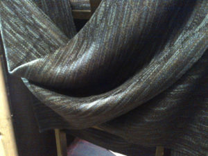 Laura Fry. Monochromatic grey, black, taupe fabric with beautiful drape